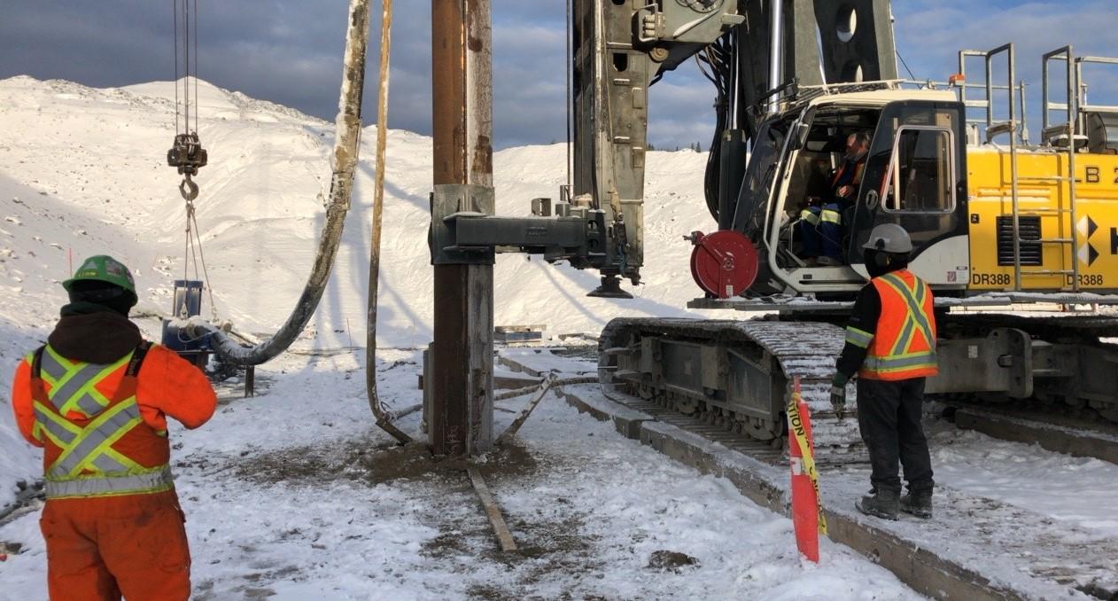 Close-up of an interlocking pipe pile being installed