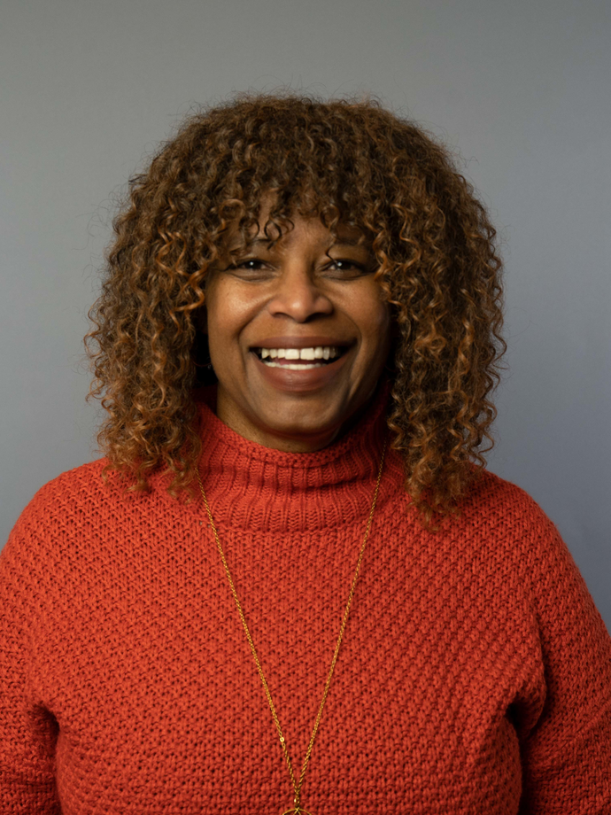 woman in orange sweater