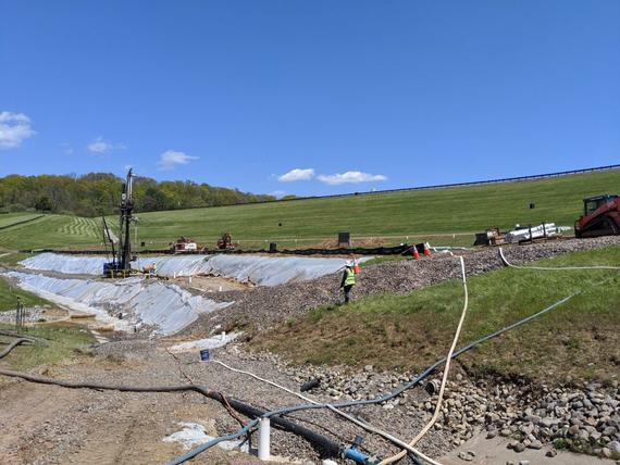 construction site at the bottom of the dam