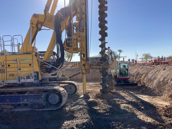 drill rig with auger performing auger cast piles