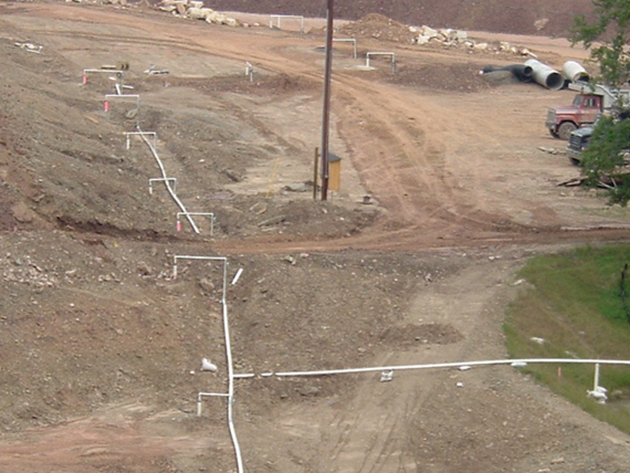 dewatering wells and pipes across a dam