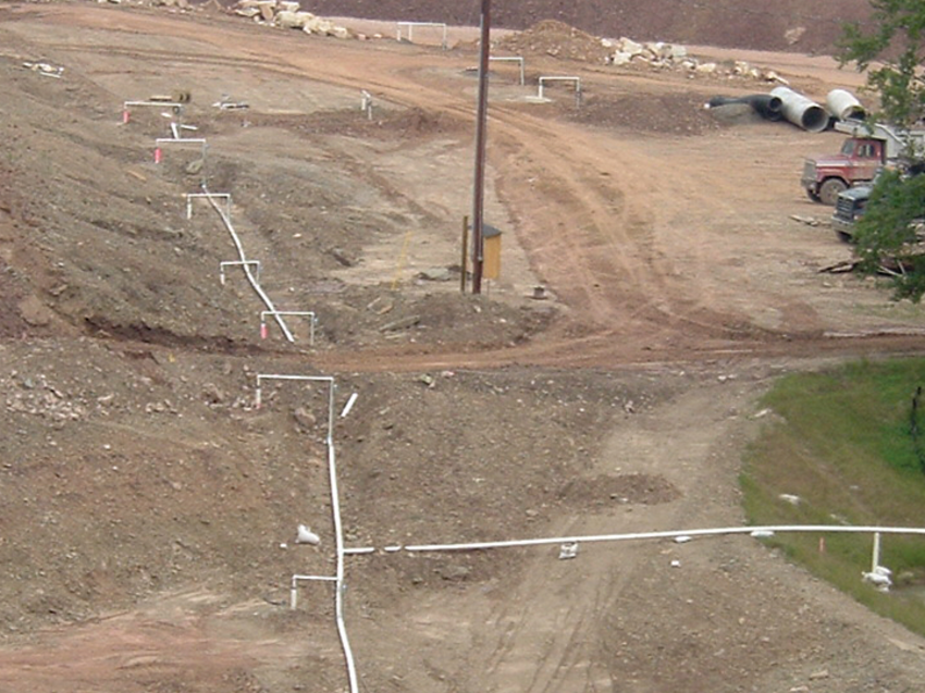 dewatering wells and pipes across a dam